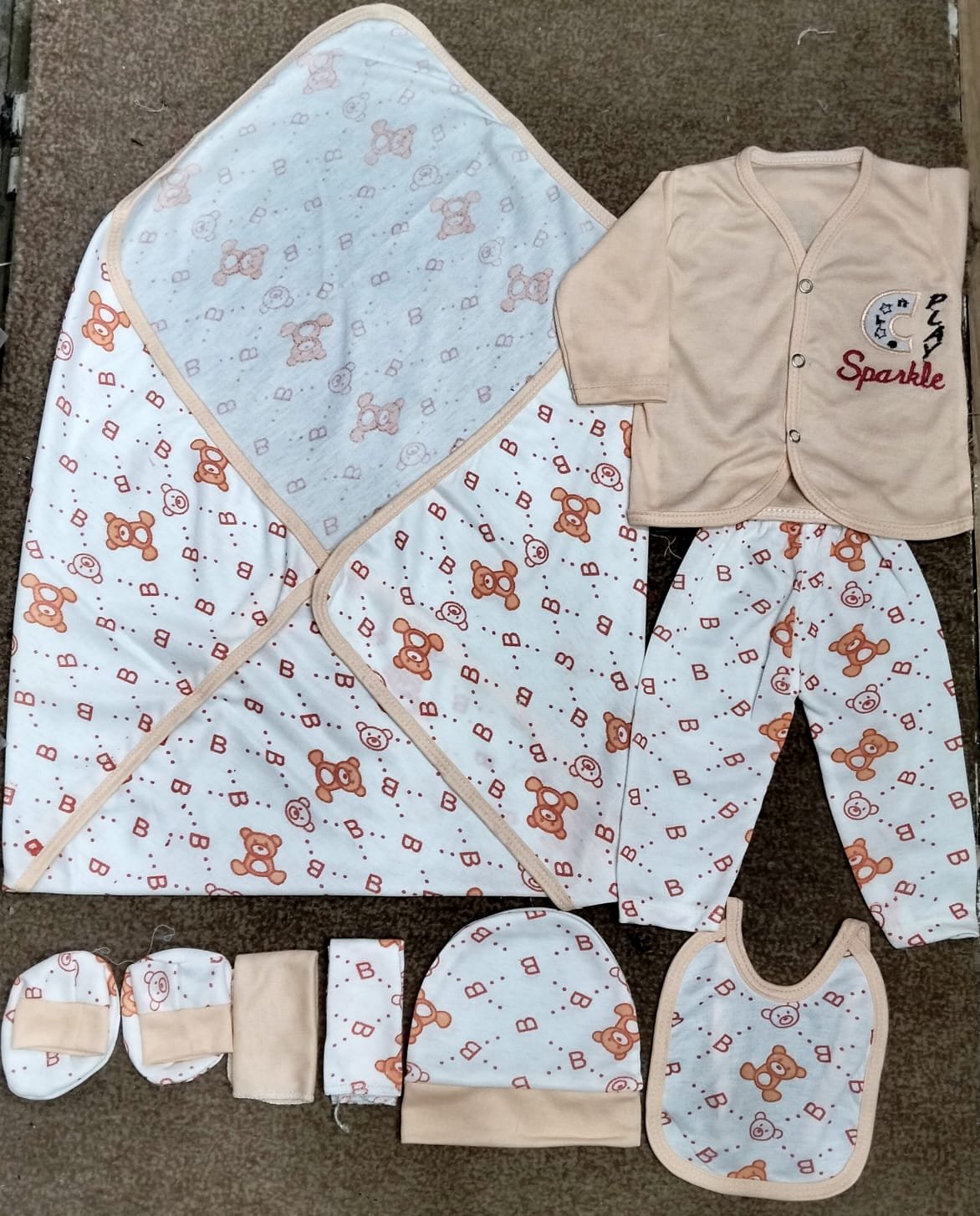 This is the Kids Boom Kids Wear 8-Piece Newborn Baby Gift Set (Bear & "Sparkle" Theme Collection).